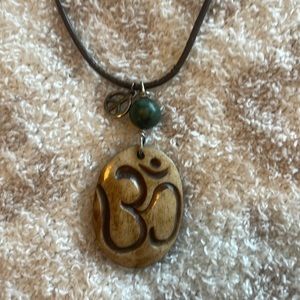 NWT Om Bone pendent with leather necklace and peace sign charm